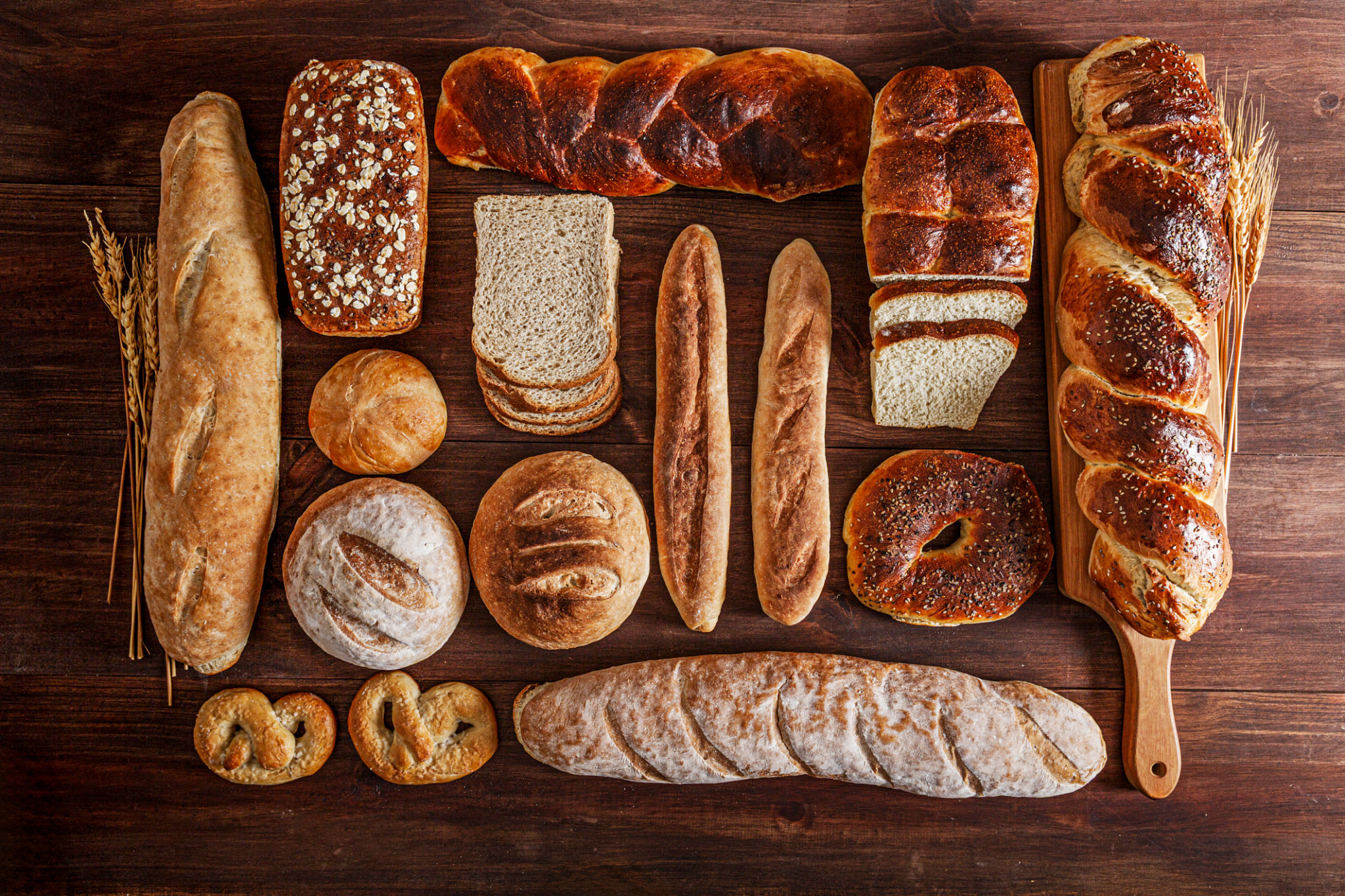 Assortment of artisan bakery bread on rustic wooden table