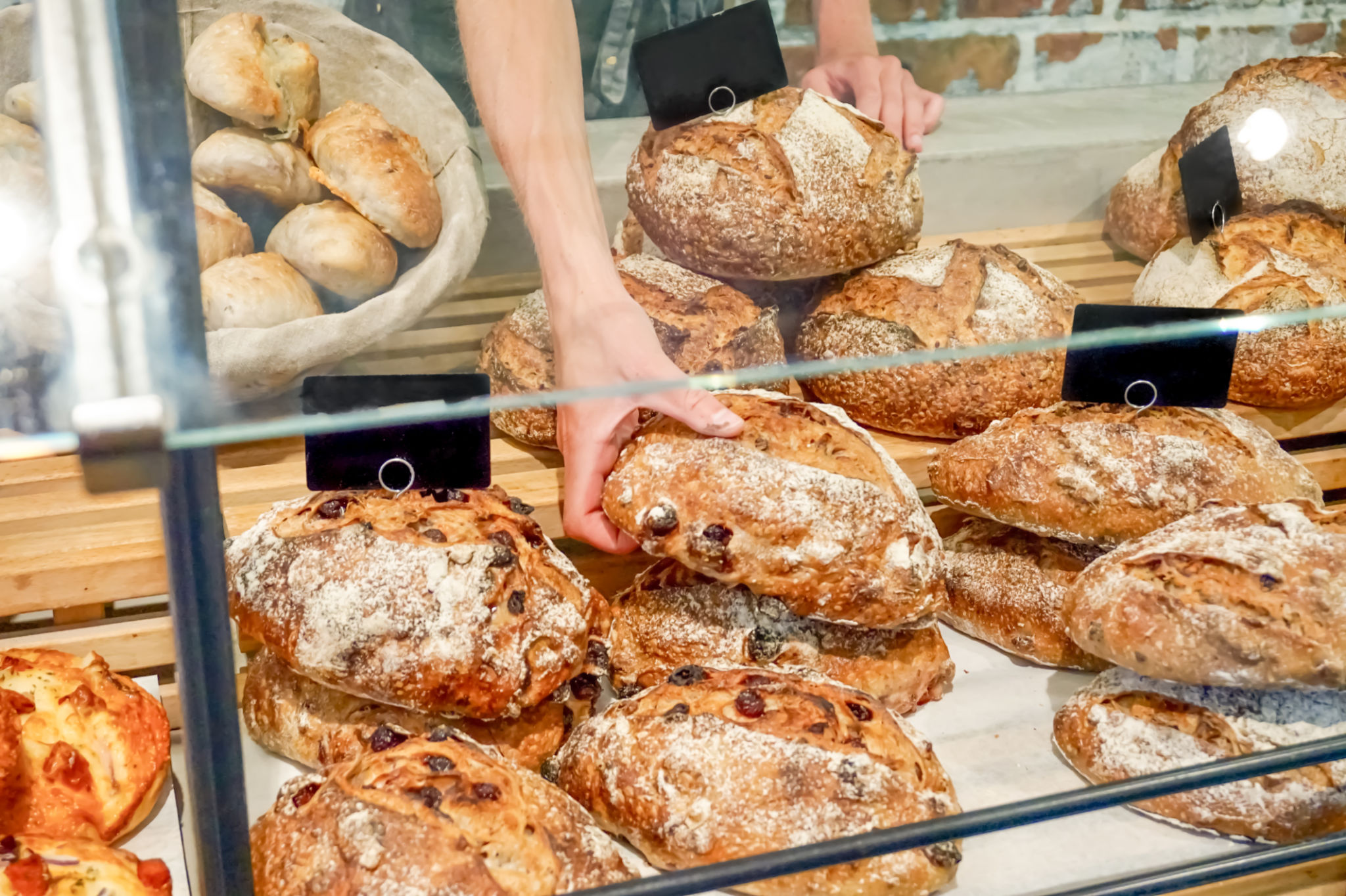 Loaves of bread at a bakery counter