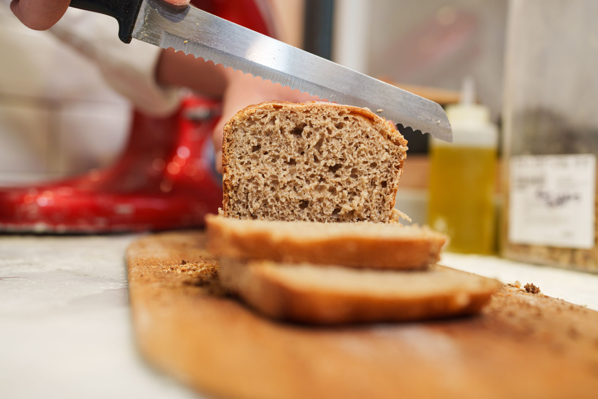 slicing whole wheat bread at the bakery